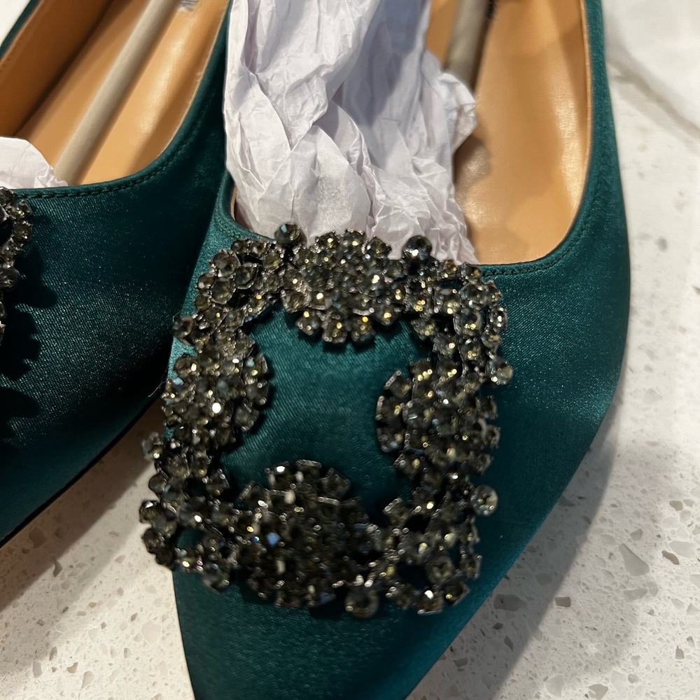Manolo Blahnik flats in Satin Green.
